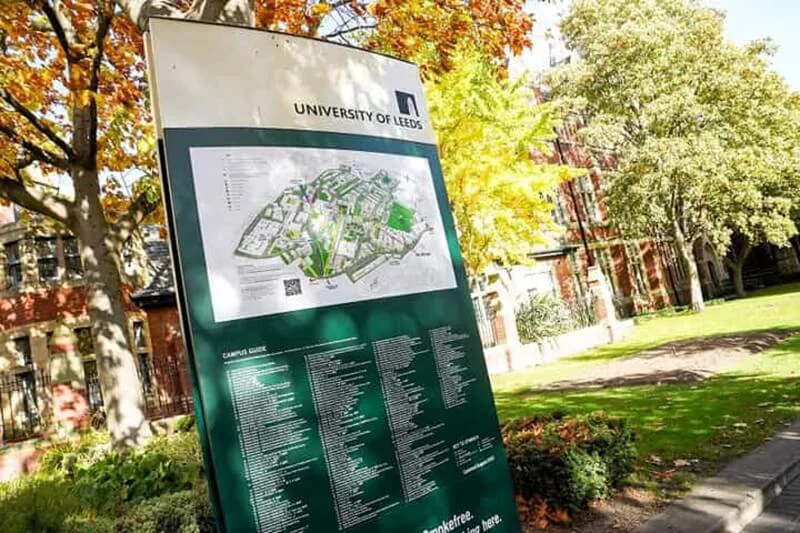 An image of exterior directional signage for a university.